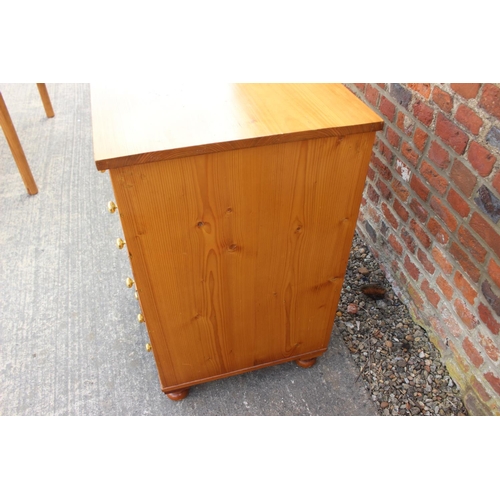 613 - An 18th century Oregon pine chest, fitted four graduated drawers over two small drawers and cupboard... 