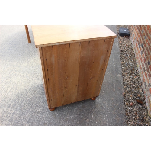 613 - An 18th century Oregon pine chest, fitted four graduated drawers over two small drawers and cupboard... 