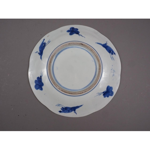 90 - An Imari dish with traditional decoration, 12