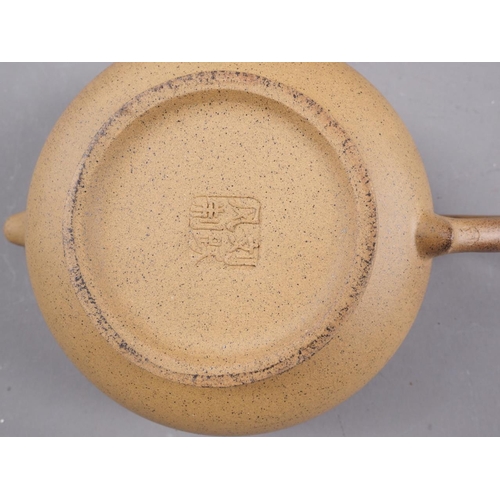 97 - A Chinese Yixing teapot with relief floral decoration, 4 1/4