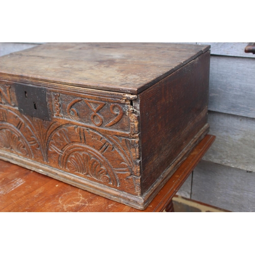 181 - A largely 17th century boarded oak box, monogrammed A N 1689, 21