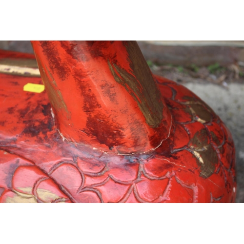 183 - A red and gilt lacquered carved model of a duck, 27