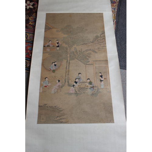 453 - A Chinese watercolour on linen scroll, women in a court garden, 36 3/4