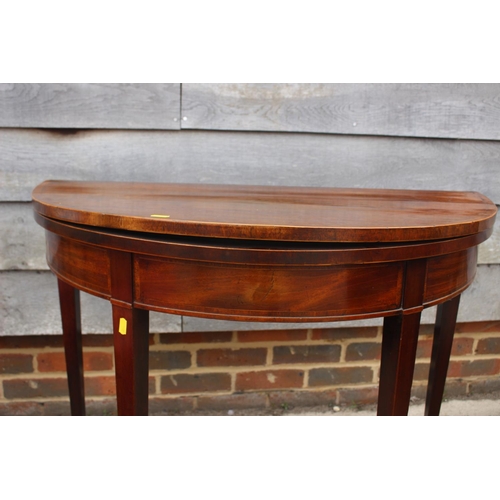 499 - A George III mahogany and banded 'D' shaped fold-over top card table, on square taper supports, 36