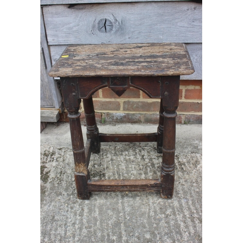 512 - A largely 17th century oak joint stool, on turned and stretchered supports, 18