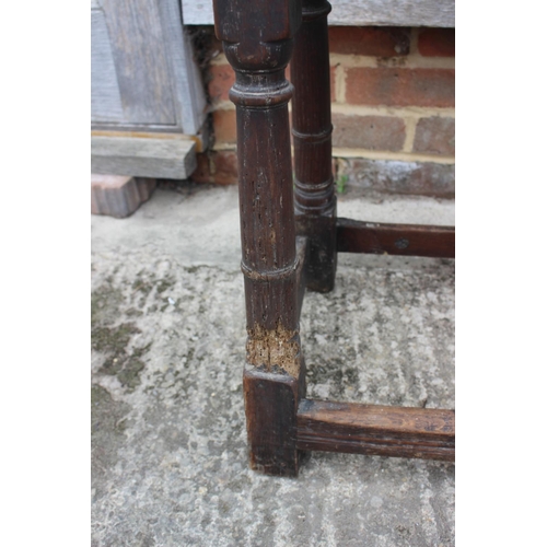 512 - A largely 17th century oak joint stool, on turned and stretchered supports, 18