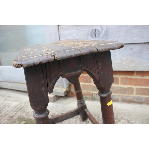 512 - A largely 17th century oak joint stool, on turned and stretchered supports, 18