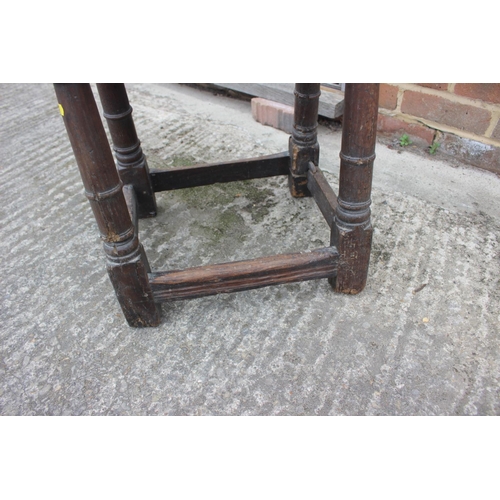 512 - A largely 17th century oak joint stool, on turned and stretchered supports, 18