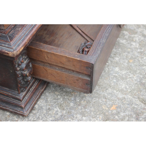 514 - An early 19th century carved oak book press with acanthus scrolls, on stand, 37