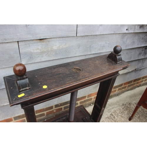 514 - An early 19th century carved oak book press with acanthus scrolls, on stand, 37