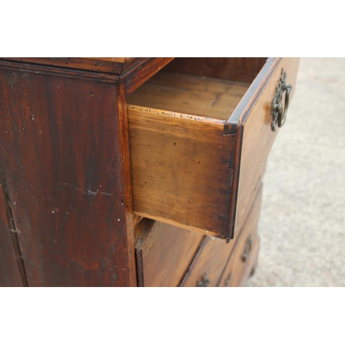 515 - An 18th century fruitwood chest of two short and three long drawers with brass bale handles, on brac... 