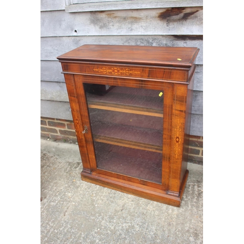 518 - A late 19th century walnut and inlaid display cabinet enclosed glazed door, on block base, 30