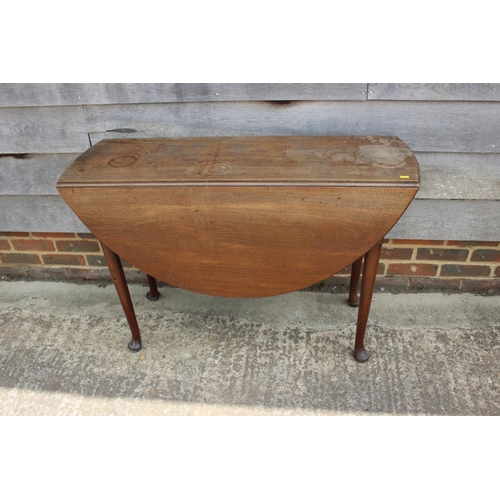 528 - An 18th century Cuban mahogany oval drop leaf dining table, on pad feet, 20