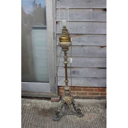 529 - A 19th century brass openwork standard lamp, on tripod scroll support