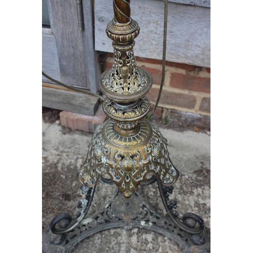 529 - A 19th century brass openwork standard lamp, on tripod scroll support