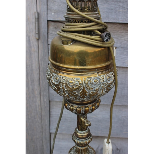 529 - A 19th century brass openwork standard lamp, on tripod scroll support