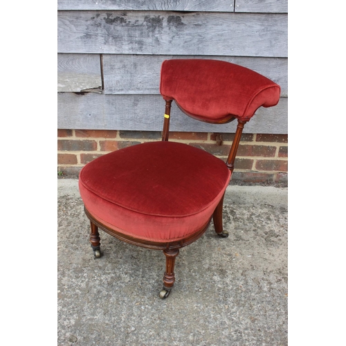 531 - A Victorian low seat occasional chair/nursing chair, upholstered in a strawberry velour, on turned a... 