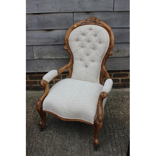 532 - A gentleman's Victorian carved walnut showframe elbow chair and lady's matching chair, upholstered i... 