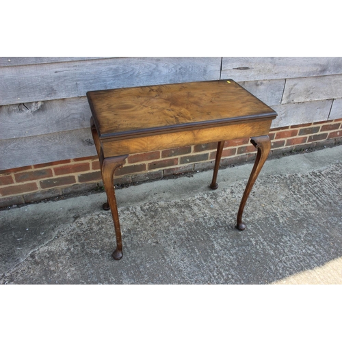 544 - A figured walnut rectangular fold-over top card table, on cabriole supports and pad feet, 30