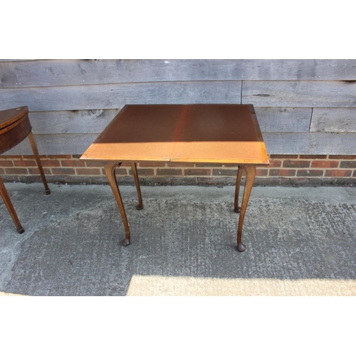 544 - A figured walnut rectangular fold-over top card table, on cabriole supports and pad feet, 30