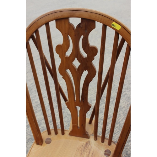 552 - A Stewart Linford yew Windsor standard chair with pierced splat and crinoline stretcher, on turned s... 