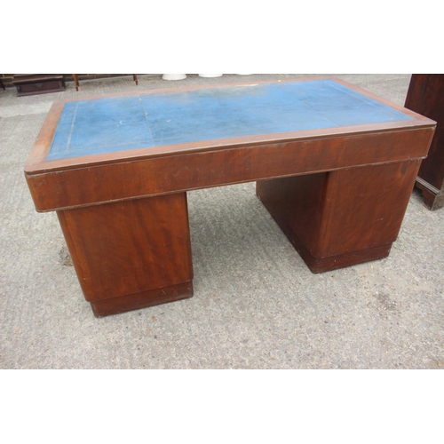 589 - A 1930s walnut double pedestal desk, fitted with military style handles, drawers and blue tooled lea... 