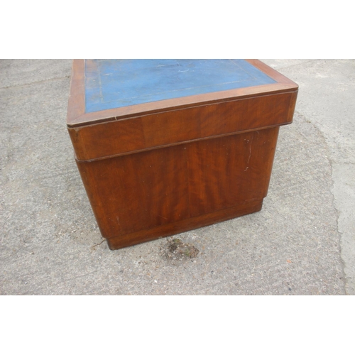 589 - A 1930s walnut double pedestal desk, fitted with military style handles, drawers and blue tooled lea... 