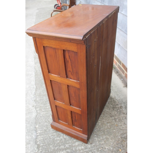 592 - An Edwardian fruitwood, pine and oak side cupboard, fitted two drawers over glazed panel door and on... 