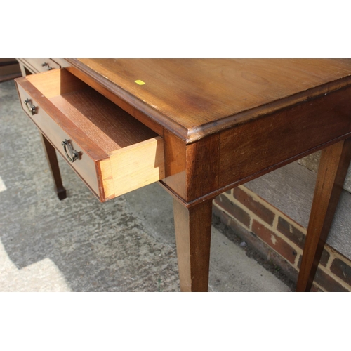 597 - A walnut side table, fitted two drawers, on square taper supports, 44