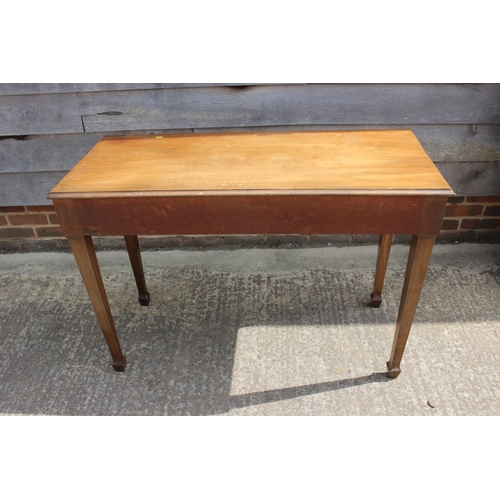 597 - A walnut side table, fitted two drawers, on square taper supports, 44