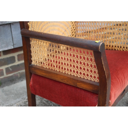 605 - A 1930s polished as walnut cane back chair, on cabriole claw and ball supports, and an oak occasiona... 