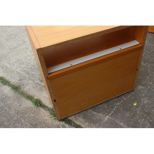 612 - A pine bedside chest of three drawers, on bracket feet, 19