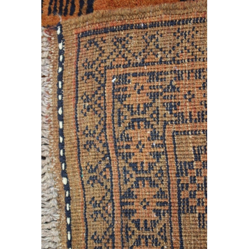 639 - A Kayam contemporary gold wash rug with eight central guls and multi-borders on an orange and natura... 