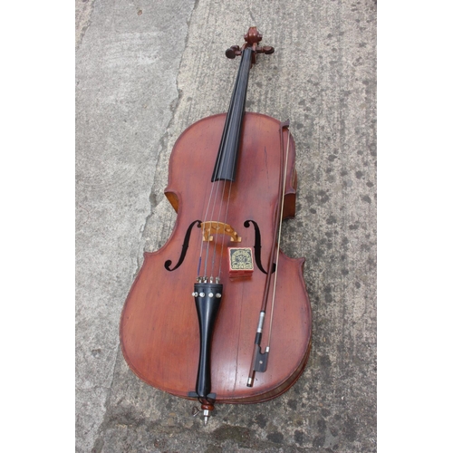 252 - A student's cello and a bow, in soft case