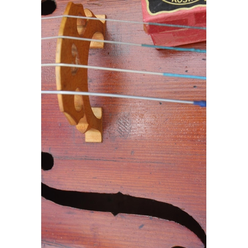 252 - A student's cello and a bow, in soft case