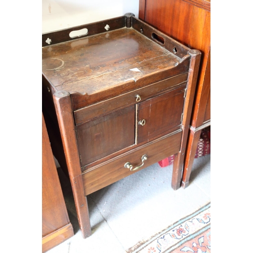 502 - A mahogany tray top bedside cabinet, fitted one drawer over cupboard and one further drawers, on mou... 