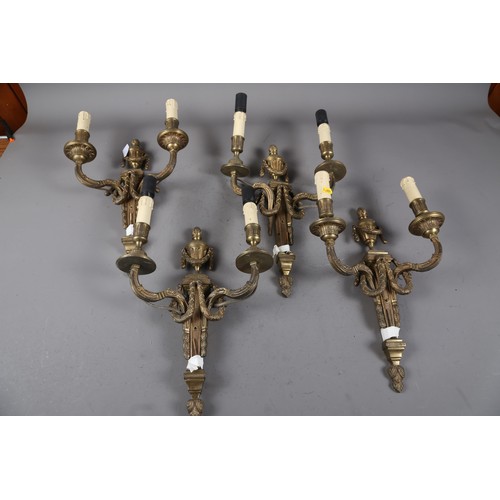 287 - A set of four tooled brass two-light wall brackets of 17th century design, 15