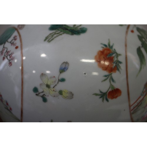 118 - A Chinese porcelain bulbous vase with enamelled panels of figures in landscapes on a floral strewn g... 