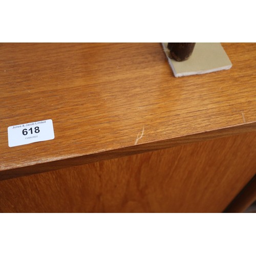 618 - A Vanson 1960s teak side board, fitted two cupboards, cellarette drawer and four drawers, on turned ... 