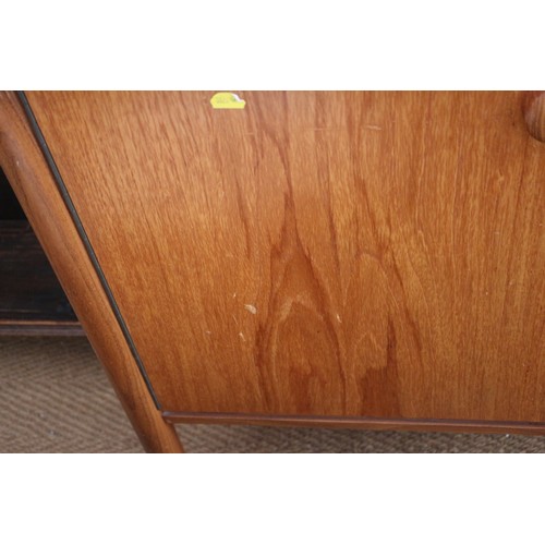 618 - A Vanson 1960s teak side board, fitted two cupboards, cellarette drawer and four drawers, on turned ... 