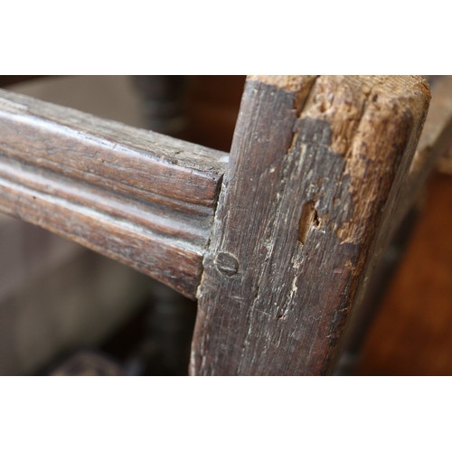 512 - A largely 17th century oak joint stool, on turned and stretchered supports, 18