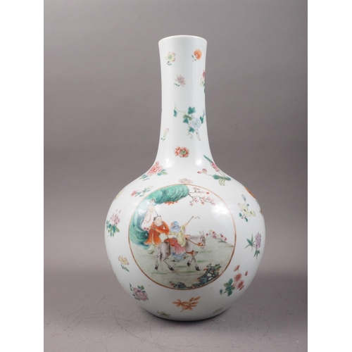 83 - A Chinese porcelain bulbous vase with enamelled panels of figures in landscapes on a floral strewn g... 