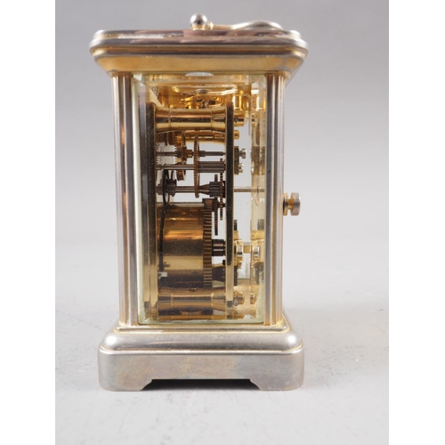 108 - A Garrard & Co white metal and gilt five glass miniature carriage clock with white enamel dial and R... 