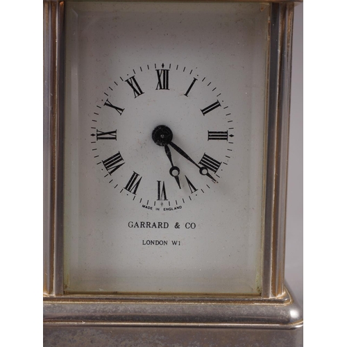 108 - A Garrard & Co white metal and gilt five glass miniature carriage clock with white enamel dial and R... 