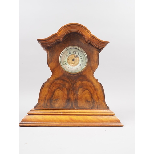 110 - An early 20th century figured walnut shape top mantel clock with gilt dial, 10 3/4