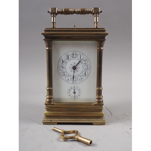 116 - A late 19th century brass cased carriage clock with hour repeat and alarm movement, 6 1/2