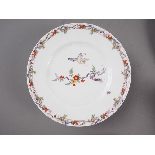 25 - A French porcelain dinner service with crane and Oriental design