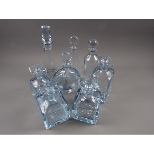 58 - Eight Strombergshyttan clear glass decanters, various sizes and shapes