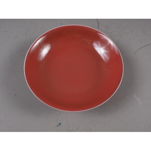 75 - A Chinese porcelain red ground shallow bowl with twelve-character mark, 7 1/2