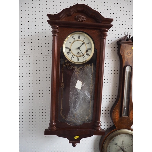 113 - A mahogany cased wall clock with enamelled dial and Roman numerals, 26 1/2